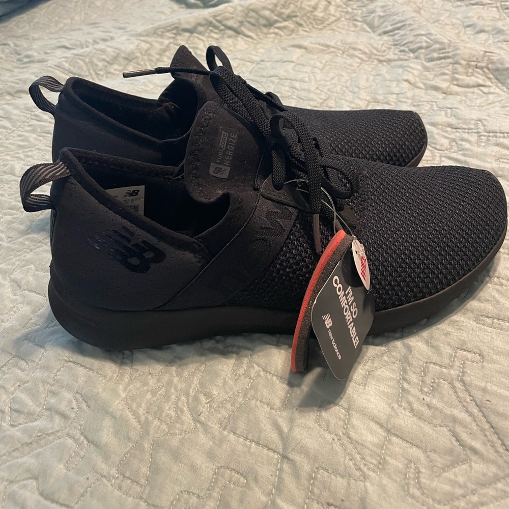 Solid black New Balance sneakers. NWT. Size 10 W.